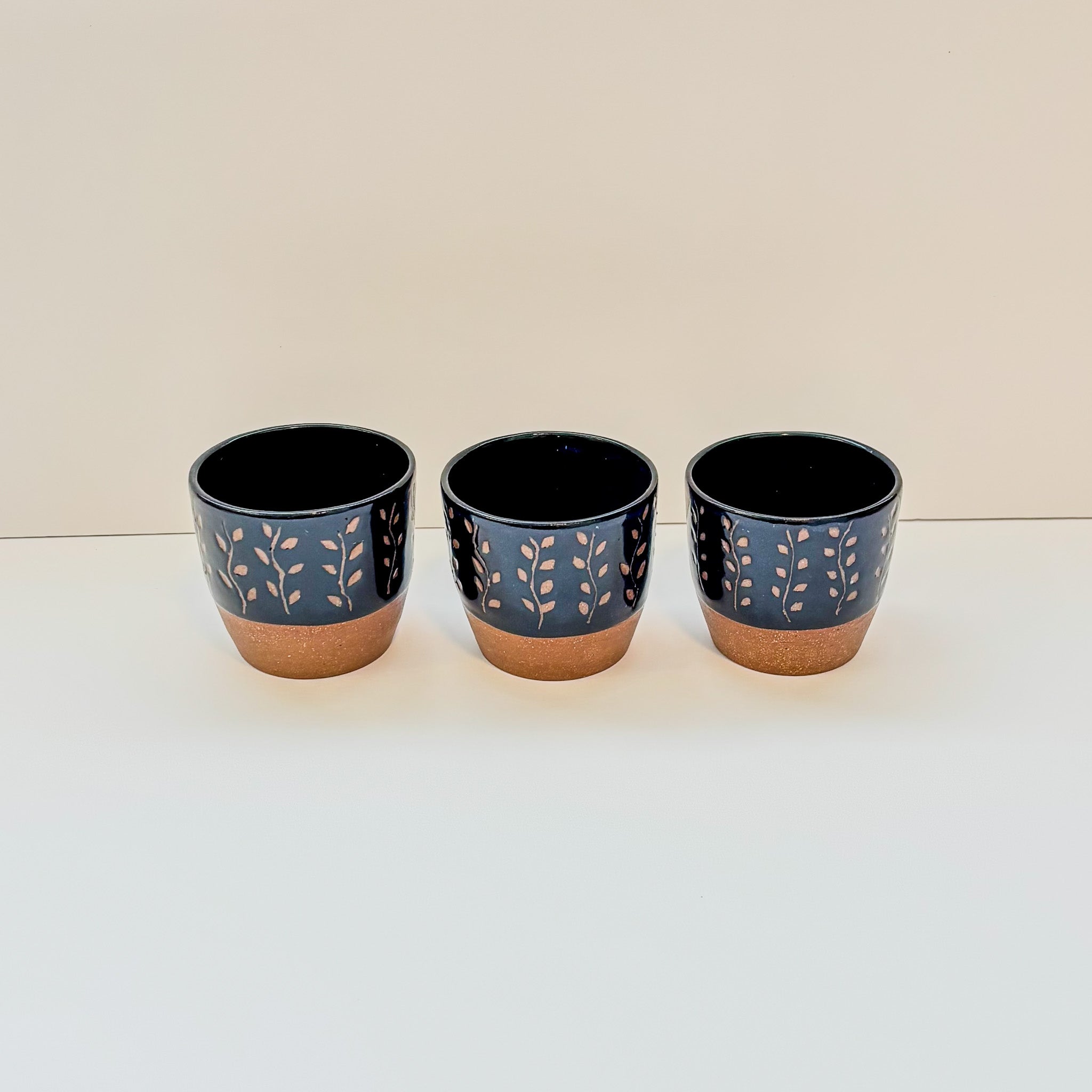 Carved vines tumblers